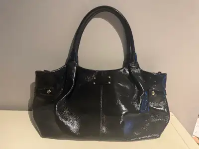 Elevate your style with this Kate Spade patent leather tote bag, perfect for everyday elegance! This...