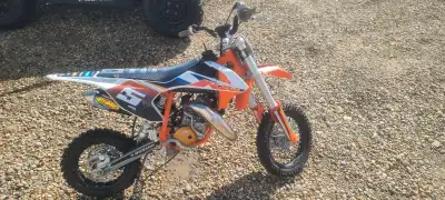 Get ready to tear up the track with this 2021 KTM SX 50 Factory Edition! This awesome little dirt bi...