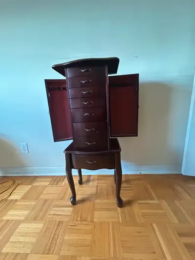 Beautiful antique solid wood jewelry chest with timeless charm. Features multiple velvet-lined drawe...