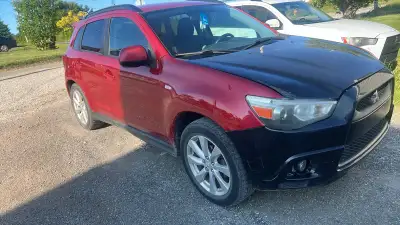 2015 Mitsubishi RVR four-wheel-drive was smashed three years ago repaired not painted rebuilt title
