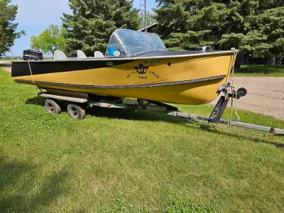 18ft aluminum boat with tandem axle trailer Very stable Motor not included Located by yorkton 1306si...