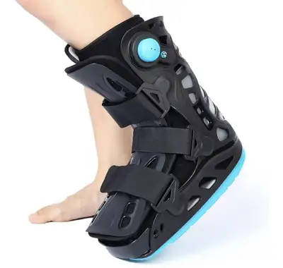 New inflatable walking boot in medium size, designed to provide support and comfort for ankle injuri...
