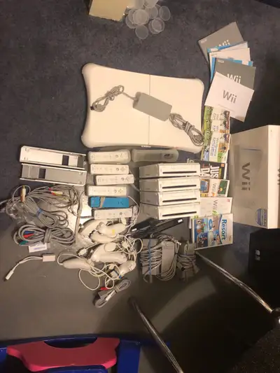 Selling a bunch of Wii consoles, games, accessories and a box with manuals. Will sell everything for...