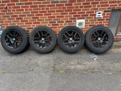 These are used (2022) 245/65R17 107H radial tires mounted on black rims, perfect for winter driving....
