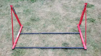 Used MotoMaster Folding Tire Storage Rack that can support 300 pounds. Mounted in my garage for a fe...