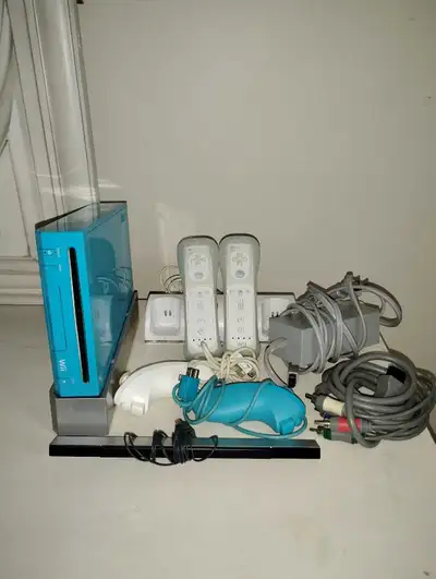 Blue Nintendo Wii comes with everything in the photo, yes everything is working. Cash only must pick...
