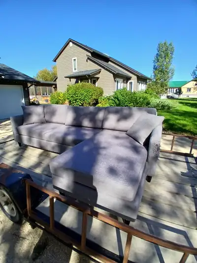 Sectional couch measures 98 inches by 65 inches, is 32 inches deep and 30 inches high. Couch is stai...