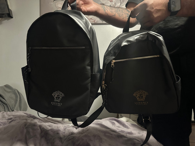 Versace parfum backpacks  in Women's - Bags & Wallets in Oshawa / Durham Region