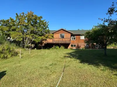 Large house with apartment in basement, 4 bathrooms, 8 bedrooms, large shop wired for apartment on t...