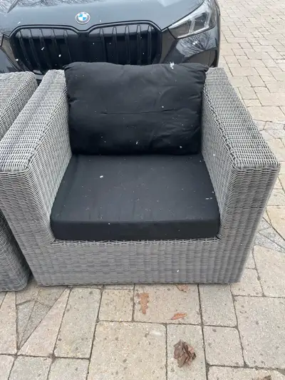 wicker chairs with black cushions. , View more