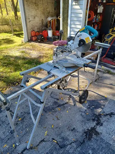 Makita 12" dual bevel sliding mitre saw w/ Rigid folding rolling stand, works excellent. *Saw blade...