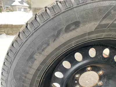 Four Toyo Observe GSI-5 winter tires. Mounted and balanced on steel rims. Formerly on a Chevy Suburb...
