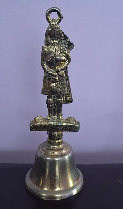 Vintage brass bell. Scottish piper figure on top. From 1960s