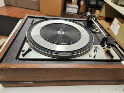 This is a vintage Dual 1218 turntable, showing signs of wear and age, and is being sold for parts or...
