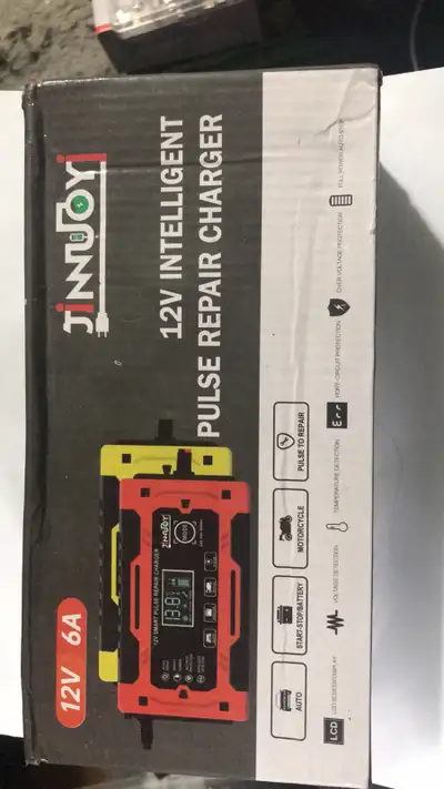 This is a new Jinmuy 12V intelligent pulse repair battery charger, perfect for keeping your batterie...