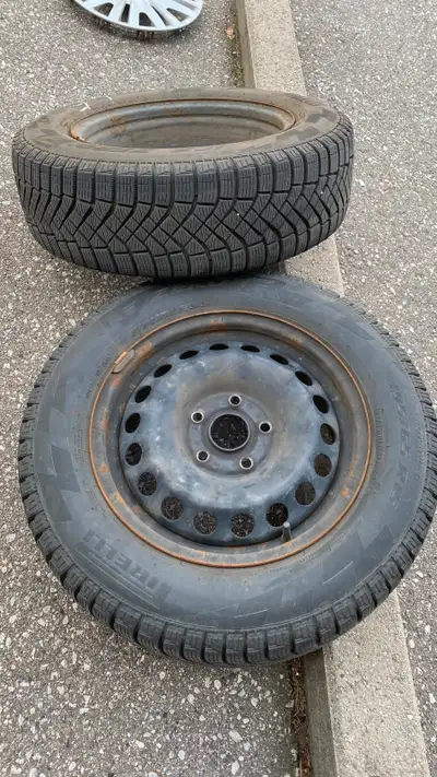 Selling a set of 4 barely used Pirelli Ice Zero winter tires mounted on steel rims. Volkswagen hub c...