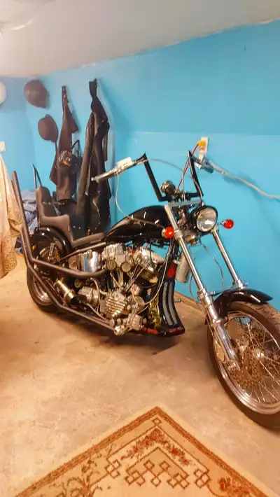 88+" stroker, dual plug heads, dual throat weber carb, open 3" belt with air shifter, 12" over dual...