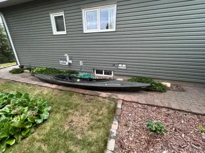 Tandem kayak comes with rudder, paddles, skirt, kayak cart, home made trailer hitch.