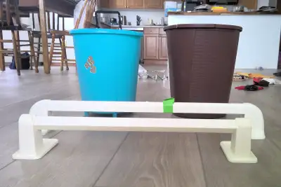 2 round wastebaskets, 2 plastic towel bars. all for $3, View more