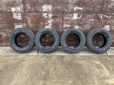 4 used Goodyear Wrangler All-Terrain Adventure tires LT275 65 R18. Good condition. No holes and no p...