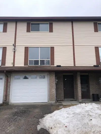 3 bedroom townhouse in Elliot Lake located steps to Spine Beach $1,750 per month plus utilities firs...
