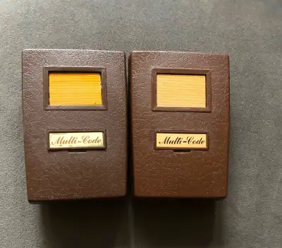 2 Multi-Code garage door openers, View more