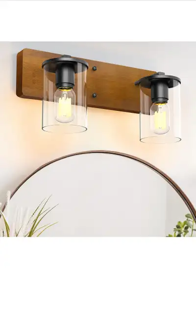 Illuminate your space with this stylish industrial farmhouse bathroom vanity light, featuring two cl...