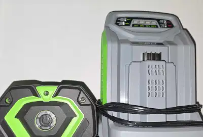 This EGO Power+ 56V 7.5Ah lithium-ion battery (Model BA4200T) comes paired with its compatible EGO c...
