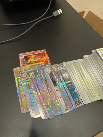 I'm selling a bulk collection of Pokémon cards, which includes a significant number of Japanese card...