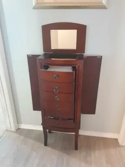 Stand up jewelry box for sale. Has mirror. Sides open as well as the drawers. Pick up north edmonton...