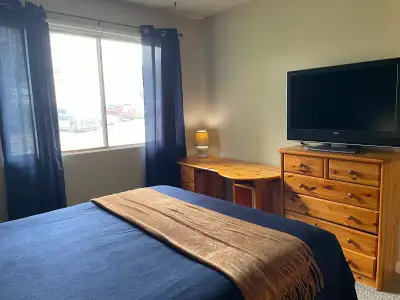 Master bedroom with 2 piece ensuite and walk in Closet in shared townhouse.Shared shower, living,kit...