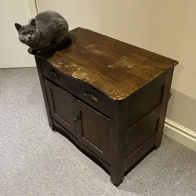 Solid hardwood. Original finish, brass bail drawer pulls, and metal rollers. Circa 1895-1905. Missin...