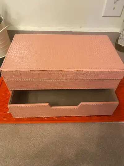 Pink glossy jewellery box from indigo. One front drawer , slots for the rings and separate compartme...