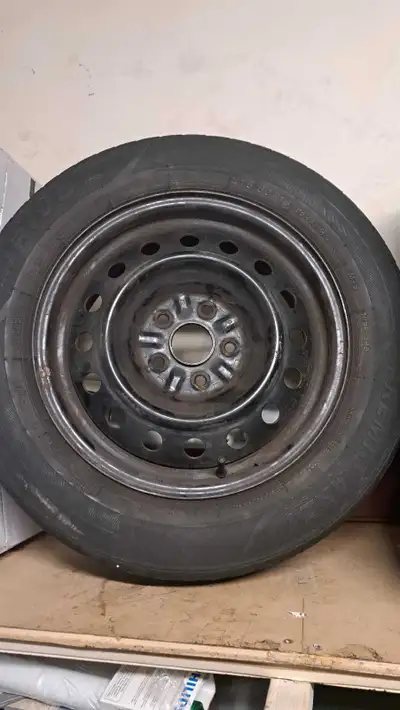 Four 215 60R 16 tires on steel rim. Tires are worn but may be able to get one season out of them
