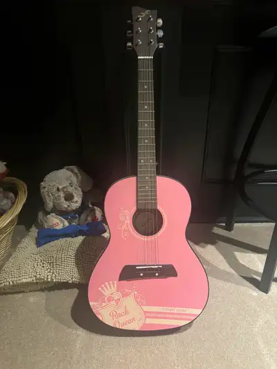 Child’s pink guitar, View more