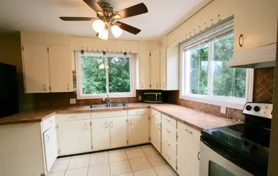 Clean, bright 3 bedroom house with a HUGE yard. Garden. Lots of character. Upper unit of a legal dup...
