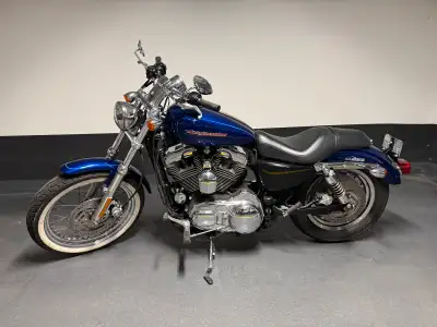 Selling my really nice super clean 2005 Sportster 1200 Custom. Beautiful blue paint very nice in per...
