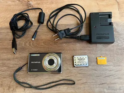 Like new condition camera pictured. Takes XD picture card or MicroSD memory card (not included). Ori...