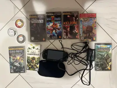 PSP 1000 with Charger, Working Battery, Case and Games $210, View more