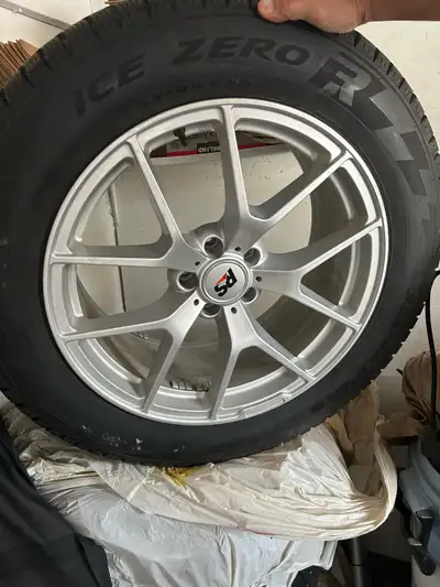 I'm selling a set of Pirelli winter tires mounted on rims, specifically sized at 255/55R19, perfect...