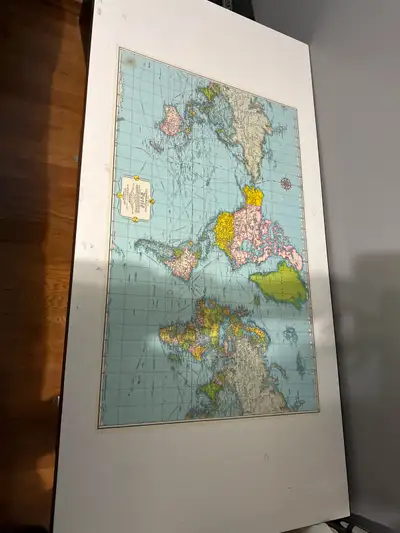 This desk features a unique world map embedded into its surface, making it a standout piece for any...