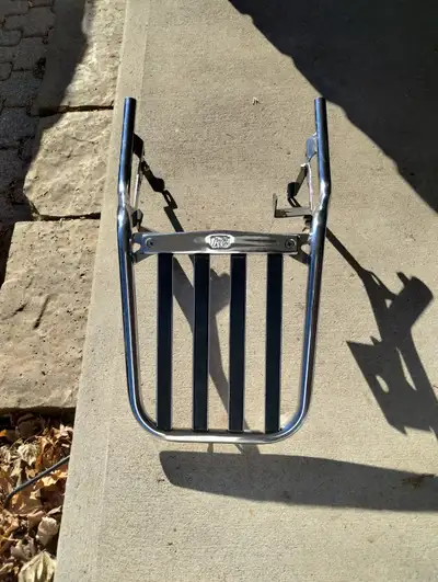 KG adjustable chrome motorcycle luggage rack. The rack is highly adjustable and known for its high-q...