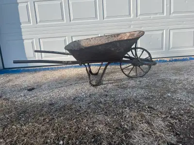 Antique Solid steel wheelbarrow. It’s in great working condition for its age. Might be good for a de...