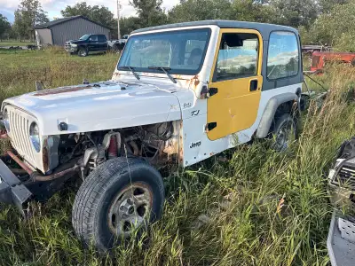 Jeep tj parts jeeps. Standard 4cyl. Trans no good. Couple extra doors and real nice extra top. Top h...