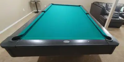 4.5 x 9 Olhausen Pool table. Professional 9 ball table. Includes balls, rest, triangle and cues. Cou...