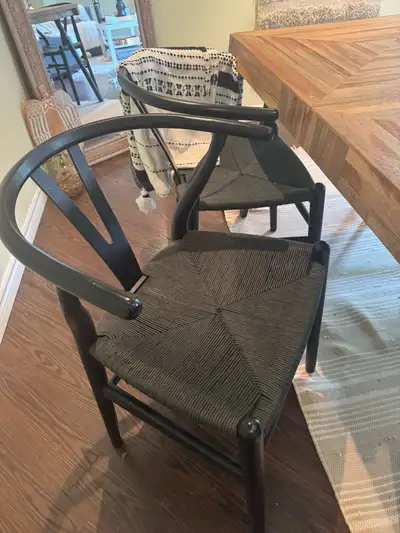 4 Black Wishbone-Style Dining Chairs – $300 for All 4, View more