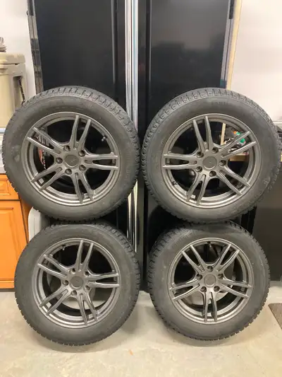 Envy Aluminum rims with Continental Ice Contact winter tires in good condition 205/55R16. Tires came...