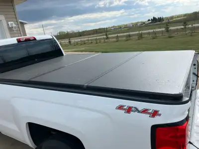 Tri-fold hardtop tonneau cover. Is currently on my 2017 Chev long box truck 8 foot box You decide if...