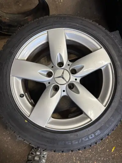 Offering a set of four 205/55R16 winter tires mounted on original Mercedes wheels. These tires are i...