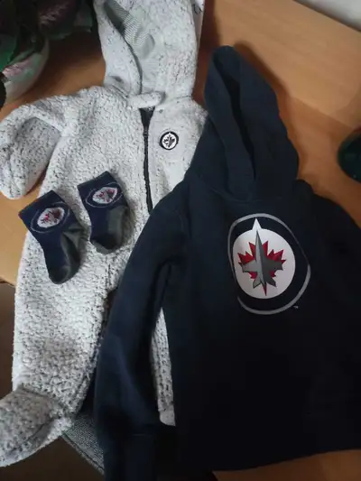 I'm offering a gently used bundle of Winnipeg Jets kids' clothes, perfect for your little hockey fan...